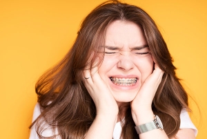 راهکارهای کاهش درد ارتودنسی